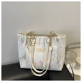 Detail of white textured tote bag with colorful embroidery and gold chain leather strap - White