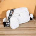 White quilted crossbody bag with coin purse and wide logo strap on wooden background - Quilted White