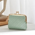 Mint green woven shell coin purse with gold clasp on a minimalist wooden tray display - Green