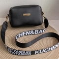 Chic black PU camera bag with golden plate and stylish wide letter strap on straw mat - Black