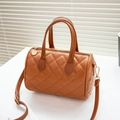 Brown quilted boston cylinder bag with gold hardware and adjustable shoulder strap - Argyle Brown