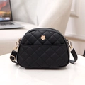 Black quilted crossbody bag with gold camellia floral ornament and adjustable strap - Black