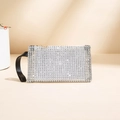 Bolso de mano con diamantes de imitación blancos, asa de cuero negro y cremallera dorada - Plateado