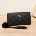 Black quilted long wallet with golden camellia floral ornament and plush pompom charm - Black