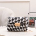 Chic black and white houndstooth crossbody bag with golden chain and metal clasp - Black