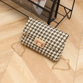 Brown houndstooth crossbody bag with gold chain strap and rectangular turn lock - Brown