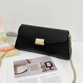 Elegant black lychee leather envelope bag with gold chain strap and striped metal lock - Black