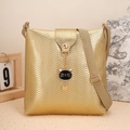 Golden crossbody bucket bag with wave pattern embossing and cute cat pendant charm - Wave Pattern with Cat Charm / Gold V