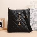 Chic black quilted crossbody bucket bag with cat charm and gold chain detail - Quilted Rhombus with Cat Charm / Black