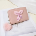 Pink polka dot bow mini wallet with fur ball pendant and secure zipper closure - Pink