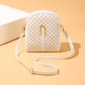 White mini crossbody bag with yellow geometric print and golden clasp detail - White