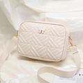 Quilted cream crossbody camera bag with gold butterfly accent and wide fabric strap - Off White