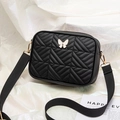 Chic black quilted camera bag with white butterfly buckle and wide fabric shoulder strap - Black