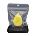 Detailed view of teardrop makeup sponge in a transparent zipper storage pouch - Yellow Pear