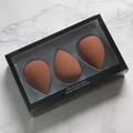 Set of 3 teardrop makeup sponges in brick red, presented in a sleek black window box - Coffee