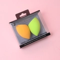 Set of two teardrop makeup sponges in orange and green, displayed in clear packaging - Orange And Apple Green
