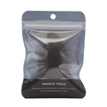 Detail view of the mango-shaped makeup sponge in transparent hanging pouch packaging - Mango Shape Black (Black Bagged)