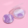 Set of two purple marble makeup puffs with round transparent storage case on pink background - Boxed Round Shape Set