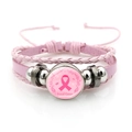 Close-up of pink leather bracelet featuring Breast Cancer Awareness ribbon charm - Breast Cancer Awareness Ribbon