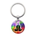 Close-up of a silver keychain featuring a circular yoga meditation and seven chakra pendant - Rainbow Radial Chakra (Silver-4)