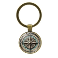 Close-up of vintage bronze nautical compass keychain with glass cabochon detail - Bronze-3