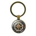 Close-up of vintage bronze compass keychain with artistic glass cabochon pendant - Bronze-2