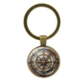 Detailed close-up of nautical compass key ring with vintage world map and glass dome - Bronze-1