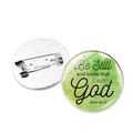Round brooch badge featuring Psalm 46:10 biblical quote on green watercolor background - Silver