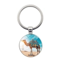 Silver metal keychain with a desert camel photo pendant against a blue sky background - Magnificent Saddle Camel (Silver-7)