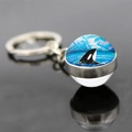 Close-up of dolphin glass ball keychain with an orca illustration and metal ring detail - Orca Iceberg Ocean Style (JY9534-11)