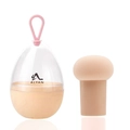 Detail of mushroom head makeup sponge and portable clear storage case with silicone strap - Mushroom Head / Nude