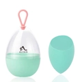 Detail of mint green teardrop makeup sponge and transparent egg-shaped storage capsule - Slanted Cut Shape / Green