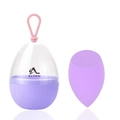 Detail of purple teardrop makeup sponge and egg-shaped storage box with pink hanging loop - Slanted Cut Shape / Purple