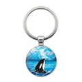 Macro view of silver dolphin keychain featuring a round orca whale art pendant - Orca Polar Ice Mountain Style(JY9532-11)