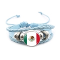 Detail of multi-layer woven leather bracelet featuring a Mexico flag glass dome charm - Mexico Flag / Blue