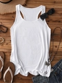 Flat lay of a white racerback tank top paired with summer accessories on a wooden floor - White