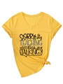 Detail of yellow V-neck T-shirt with 'Sorry Is My Teaching' print and front knot design - S / Yellow