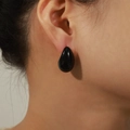 Glossy black teardrop earrings in 18k gold plated copper on ear model view - Large / Black