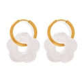 Minimalist gold hoop earrings featuring translucent white resin flower charms with marble texture - Transparent Earrings
