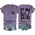 Flat lay of purple SUN SALT SAND graphic T-shirt and ripped denim shorts set - S / Purple
