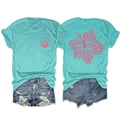 Mint green t-shirt with pink hibiscus print paired with distressed denim shorts - Deep Water Blue