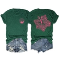 Detail view of pink hibiscus flower print with seashells on back of green cotton t-shirt - Vintage Green