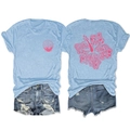 Detail showing hibiscus flower print on light blue t-shirt and ripped denim shorts - Light Blue