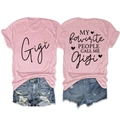 Front and back detail of pink Gigi t-shirt with ripped denim shorts set on white background - Pink (Black Graphic)
