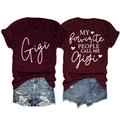 Detail view of burgundy Gigi T-shirt showing printed lettering and heart sequin accent - Wine Red (White Graphic)