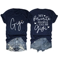 Flat lay of navy Gigi t-shirt with leopard heart and distressed denim shorts set - Navy Blue (White Graphic)