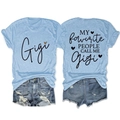 Light blue crewneck T-shirt with Gigi print paired with distressed denim shorts - Light Blue (Black Graphic)
