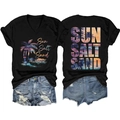 Flat lay of V-neck T-shirt with Sun Salt Sand print and distressed denim shorts - Black