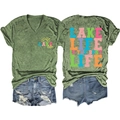 Flat lay of army green V-neck T-shirt with Lake Life print and distressed denim shorts - Olive Green