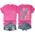 Flat lay of pink V-neck T-shirt with Lake Life prints and distressed denim shorts - Rose Red